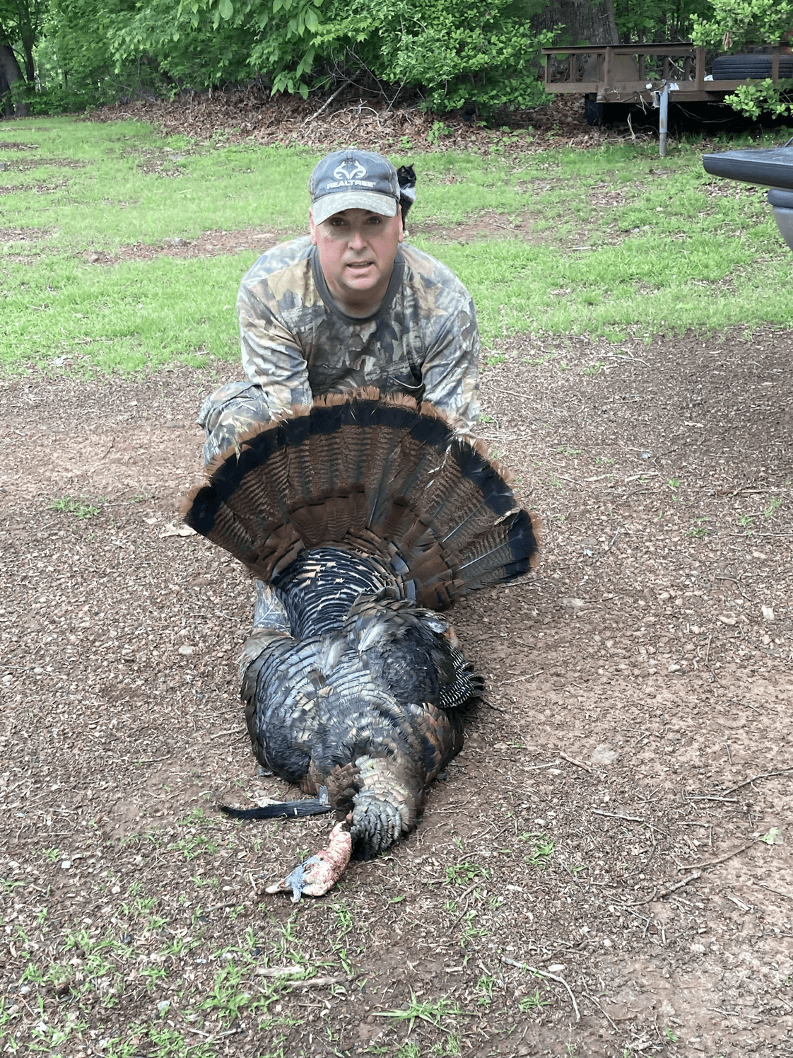 Original photo of a turkey hunter with his bird